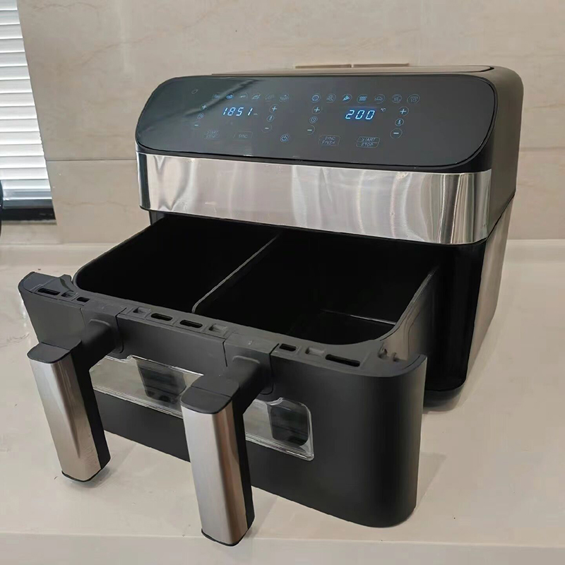 How does the energy consumption of the Twin Pot Electronics Air Fryer compare to traditional ovens and stovetops?